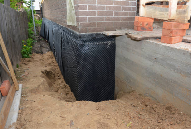 Happy homeowners after waterproofing job in Powder Springs